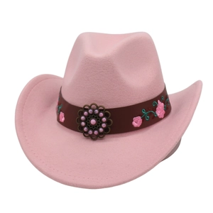 Detail of pink felt cowboy hat featuring flower embroidery and bronze sunflower buckle