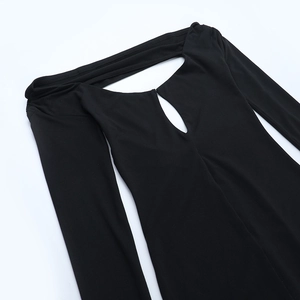 Detail of black off-shoulder long sleeve dress featuring neck cutout and slim fit