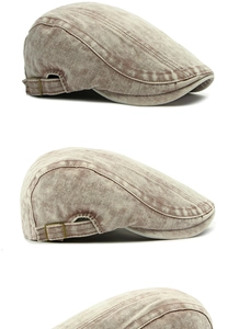 Detail view of washed cotton denim beret featuring adjustable side metal buckles