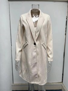Detail of almond long wool blend coat featuring classic lapels and a single black button