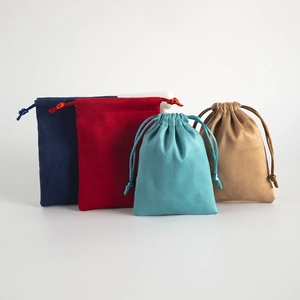 Macro shot of assorted color velvet drawstring pouches for jewelry and gift packaging