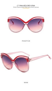 Vista dettagliata degli occhiali da sole cat-eye rosa con lenti sfumate viola
