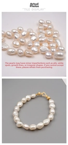 Macro detail of baroque freshwater pearls and gold-plated clasp on elegant bracelet