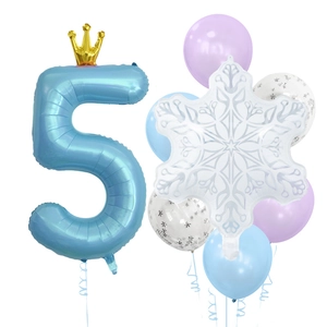 Detail of light blue number 5 foil balloon with golden crown and snowflake decorations