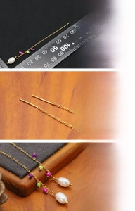Detailed view of handmade long pearl earrings with 18K gold plated chain and colorful beads