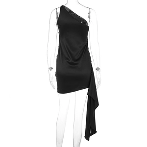 Detail of black one-shoulder mini dress featuring an asymmetric flowing drape design