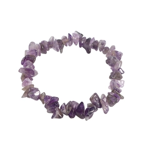 Macro shot of natural amethyst stone bracelet showing raw purple crystal textures