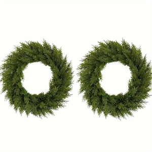 Macro detail of dense artificial green pine needles on a lush Christmas wreath decoration