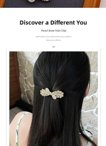 Detail view of an elegant pearl and rhinestone bow spring hair clip on long hair