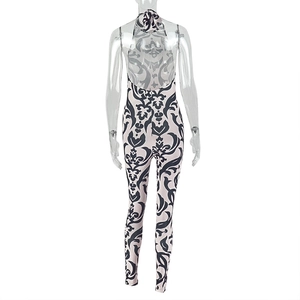 Detail of backless halter neck design on black and white baroque print jumpsuit
