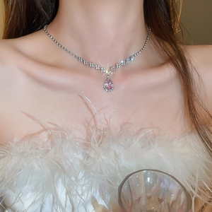 Detailed view of luxury pink teardrop pendant necklace with sparkling micro-pave diamonds