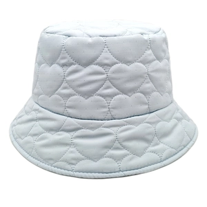 Detail of light blue bucket hat featuring quilted heart pattern and satin finish