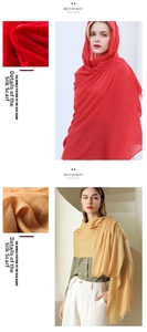 Close-up of red and yellow solid color scarves with fine woven texture and soft fringe
