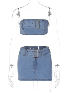Detail of denim two-piece set with buckle tube top and mini skirt on a mannequin