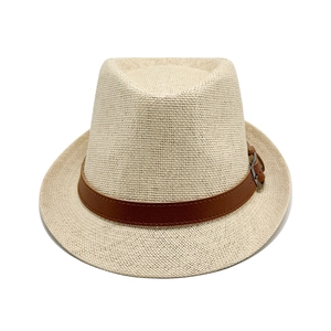 Straw Panama hat in cream with dark brown leather belt buckle on white background