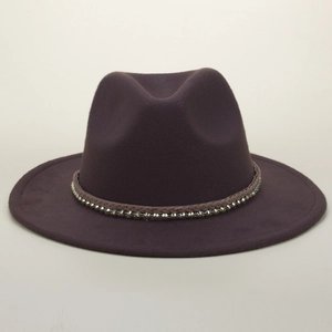 Detail of burgundy fedora with brown braided rope band and gold cone studs accessory
