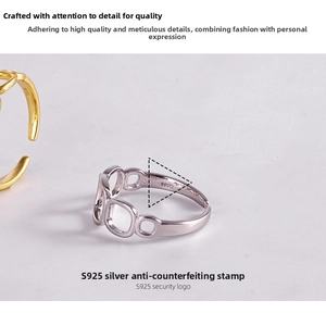 Macro view of S925 sterling silver ring showing the geometric hollow design and hallmark