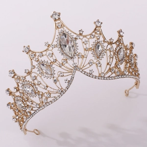 Detail of vintage gold bridal tiara featuring marquise and round crystals