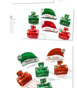Detail of Christmas themed hair claws with Santa hat and tree designs in festive red and green