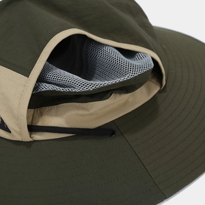 Detail of outdoor sun hat with breathable mesh vents and reinforced stitching