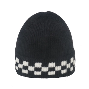 Winter black knit beanie with black and white checkerboard pattern on the folded cuff