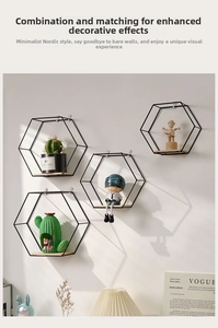 Detail of hexagonal matte black iron wall shelf with solid wood base in nordic style