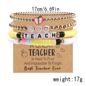 Detailed shot of teacher appreciation clay bead bracelet set on a kraft gift card