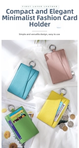 Detail view of colorful lychee grain leather card holders with metal ring on satin