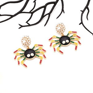 Gothic spider earrings with colorful enamel legs and white pearl base on white background