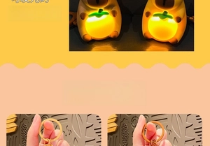 Luminous Capybara keychain featuring a glowing persimmon accessory and metal clip