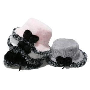 Plush faux fur bucket hats with bows in pink, white, black, and grey colors