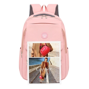 Pink waterproof nylon school backpack for girls with ergonomic straps on white background