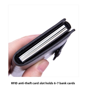 Detail of RFID blocking black leather card holder with pop-up aluminum mechanism