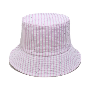 Detail of pink and white striped bucket hat with small sparkling rhinestone accents