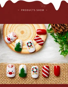 Detailed view of Christmas press-on nails featuring reindeer, tree, and wreath designs