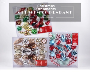 Close-up of shatterproof Christmas ornament set with 44 pieces in festive red and green