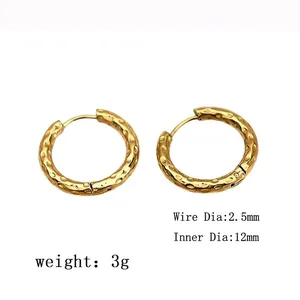 Detail view of hammered gold hoop earrings showing 12mm diameter and 2.5mm wire gauge