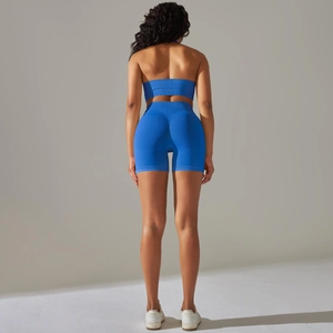 Detail of royal blue ribbed yoga set featuring a racerback top and high-waist shorts