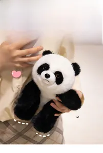 Close-up of soft plush panda doll held by a model showcasing its texture and size