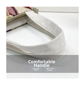 Detail of durable canvas tote handle with colorful ethnic embroidery and sturdy stitching
