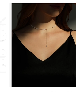 Elegant s925 silver star pendant necklace worn by a model with soft lighting