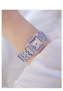 Close-up of a silver square watch for women with rhinestones and Roman numerals