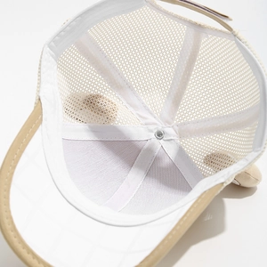 Close-up of breathable mesh lining and adjustable strap on a cute cartoon kids sun hat