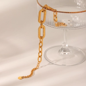 18K gold textured oval link stainless steel chain bracelet for women on glass