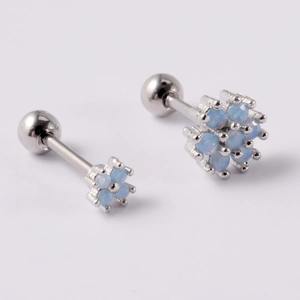 Detail of silver stud earrings featuring light blue opal flower clusters with screw-back balls