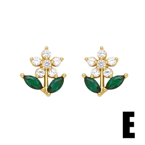 Detail of flower stud earrings with white zircons and green marquise leaves on gold base