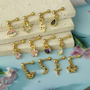 Detail shot of gold surgical steel cartilage studs with colorful zircon charms and screw backs