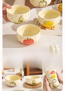 Detail of hand-painted ceramic bowls with cute fruit patterns like avocado and lemon