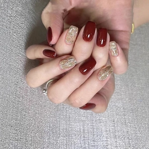 Classic glossy red and gold glitter short square press-on nails with shiny gold foil accents
