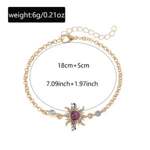 Detail view of gold sun bracelet with purple stone and dimensions 18cm plus 5cm extender